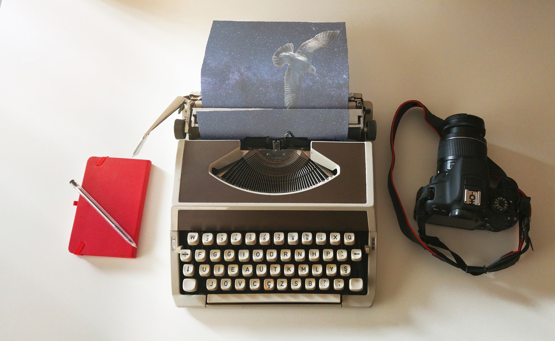 Picture of a typewriter, camera and notepad illustrating the story you can create.
