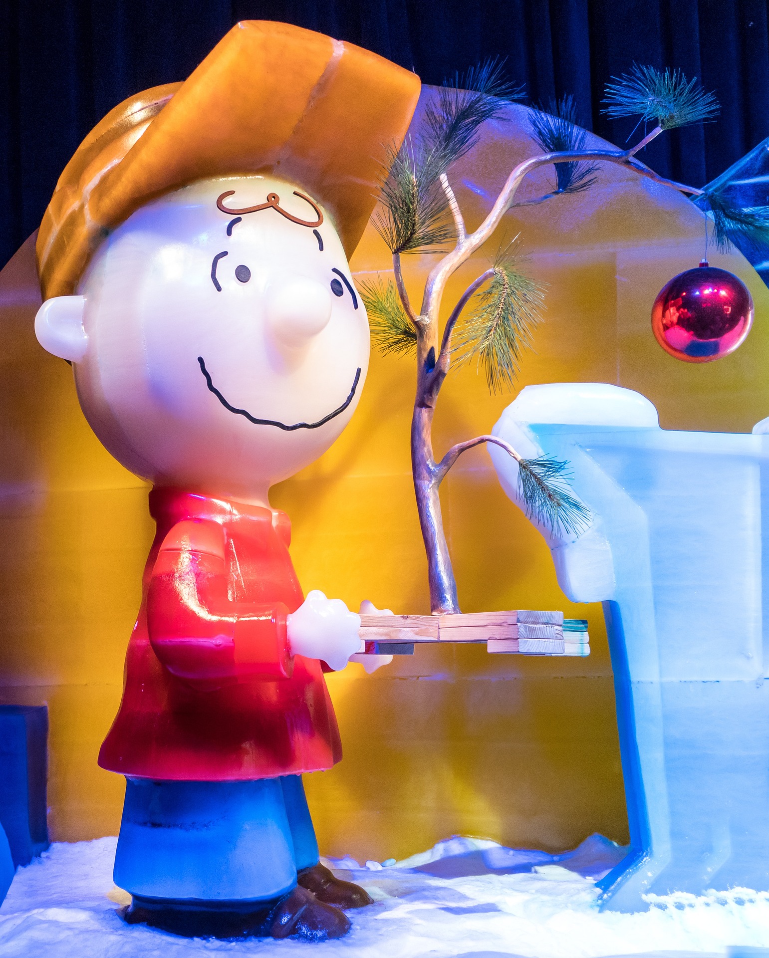 Ice sculpture of Charlie Brown with a Charlie Brown Christmas Tree